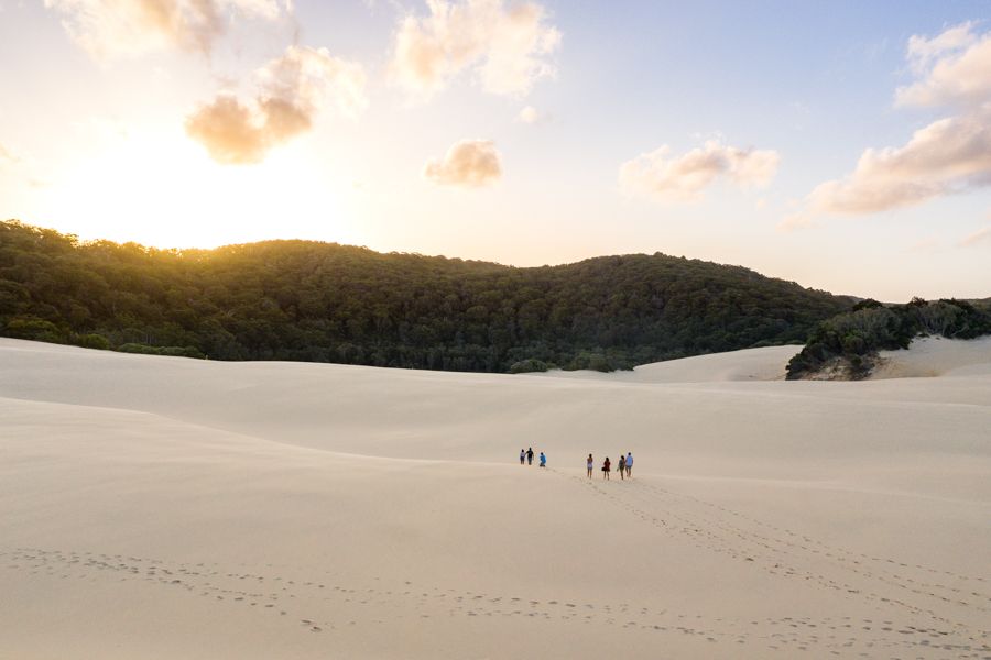 people walking on the sand dunes of K'gari (Fraser Island)