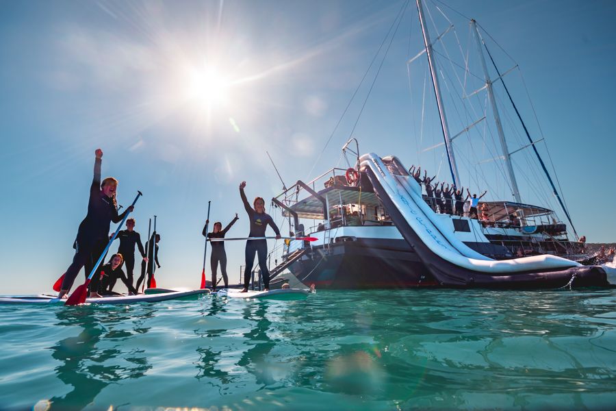 Group of people wearing stinger suits in the Whitsundays, Swim in the Whitsundays