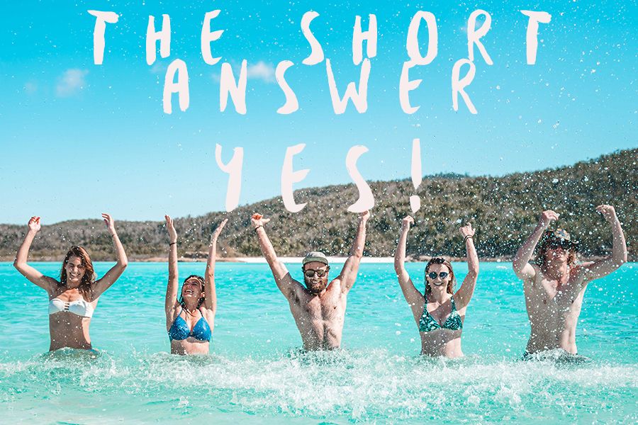 Group of people splashing in the shallows, Swim in the Whitsundays