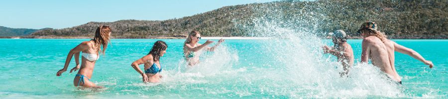 Couples having fun on whitehaven beach