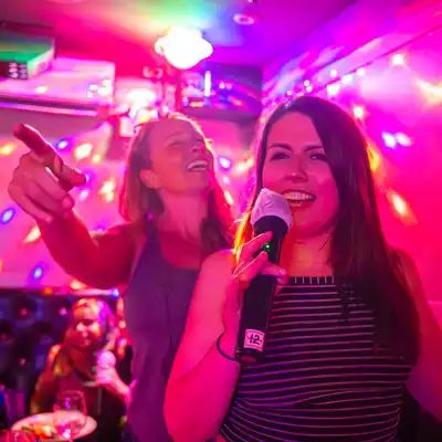 Karaoke with two women singing