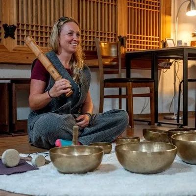 A woman with a singing bowl