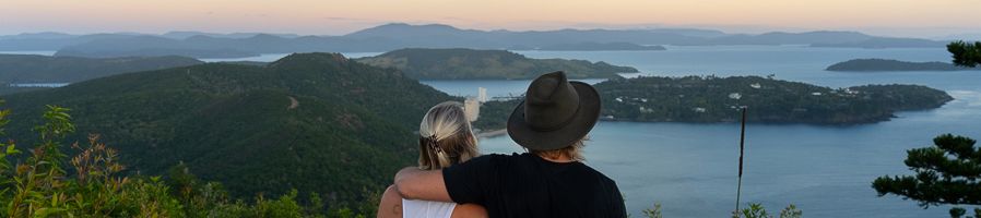 couple at a hamilton island viewpoint