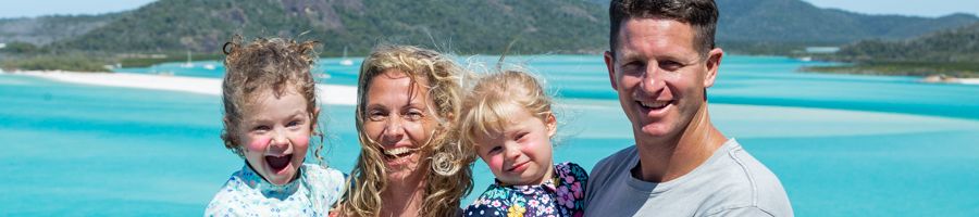 family smiling at hill inlet lookout whitsundays