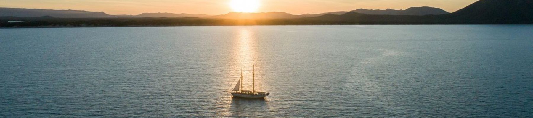 Tallship sailing in the Whitsundays at sunset