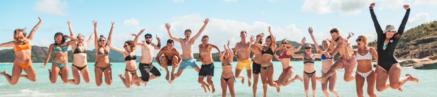 Whitehaven Beach Boomerang crew jumping