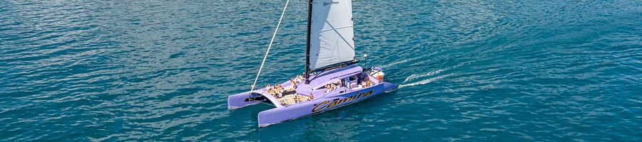 Camira sailing catamaran in the Whitsundays with the sails up