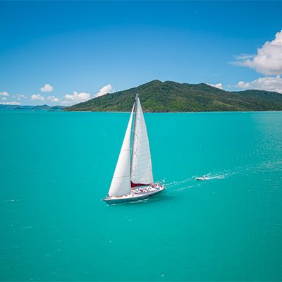 sailboat cruising over turquoise waters 