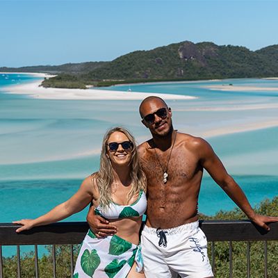 couple posing at hill inlet lookout in the whitsundays