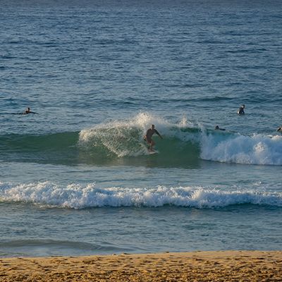 Surfing Man at Noosa Beach