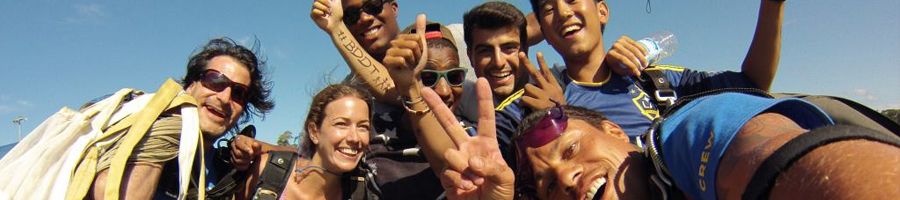 A group of people skydiving in their gear