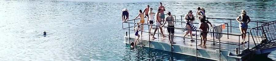 Group of people swimming at Lake Eacham, Cairns