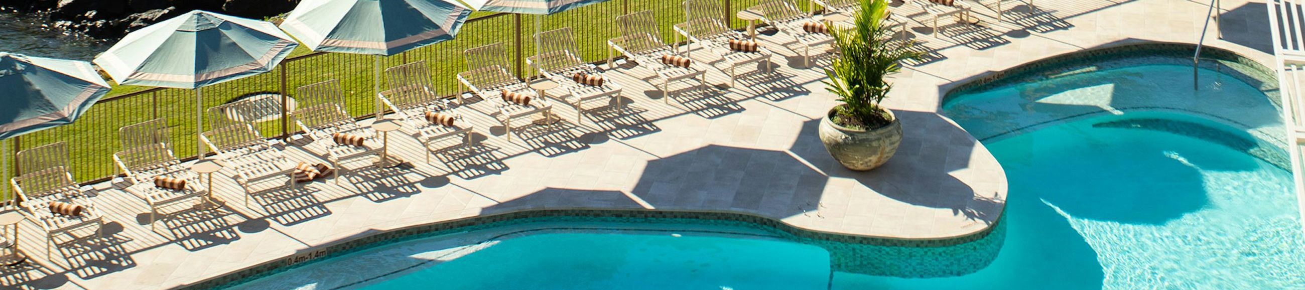 pool with lounge chairs on hamilton island