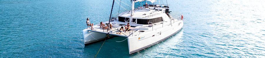 A white catamaran Getaway on the Whitsunday waters