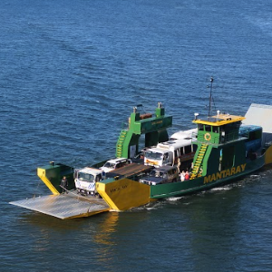 ferry pulling up to the shores on k'gari