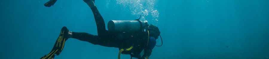 A girl scuba diving on the Great Barrier Reef