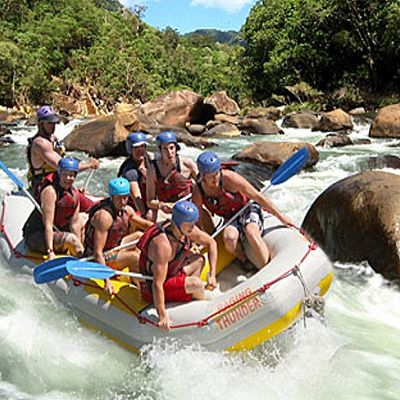 Group of rafters in an inflatable vessel going down the creek