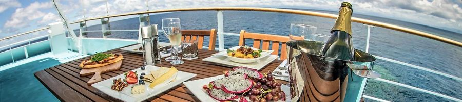 premium meal on the top deck of reef encounter cairns