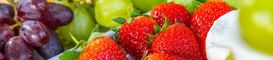 tropical fruit platter with strawberries and graps