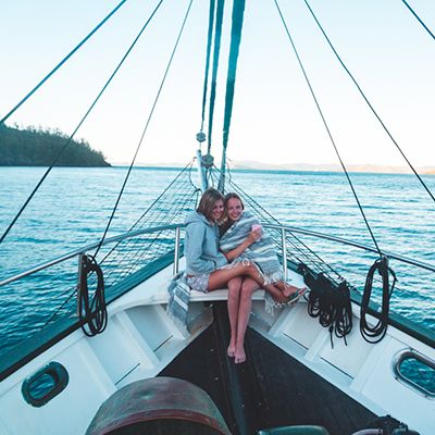 Two people hugging at the stern of a ship