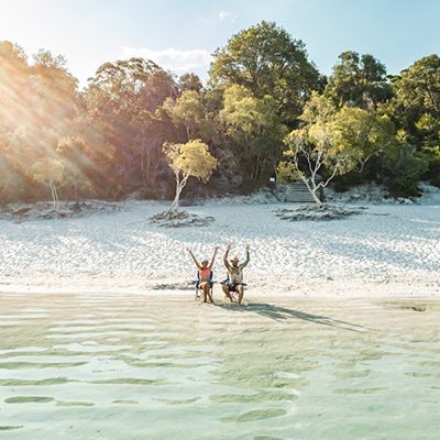 Two backpackers in a chair at Lake Mackenzie