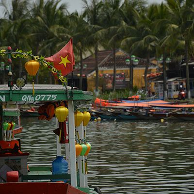 Hoi an river boat with the vietnamese flag