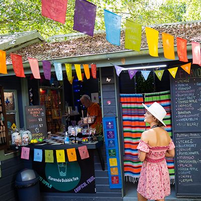 Person wandering through a colourful market