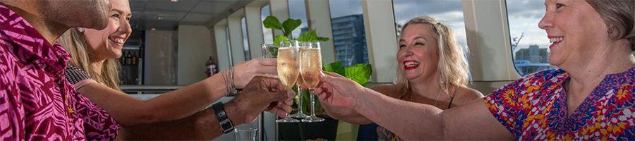 Four people toasting with a glass of champagne