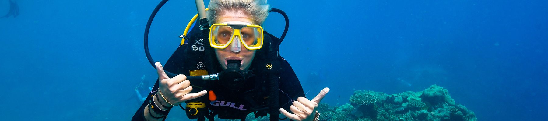 Woman scuba diving in the Great Barrier Reef