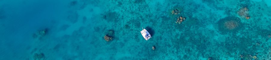 whitsunday blue over the blue water and coral reefs