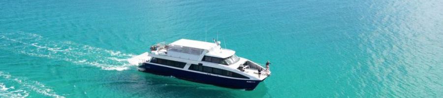 Tasman Ventures boat crossing turquoise water