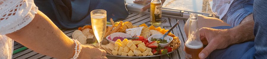 cheese board and drinks spread on milady sunset charter