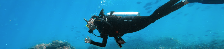 A woman underwater scuba diving