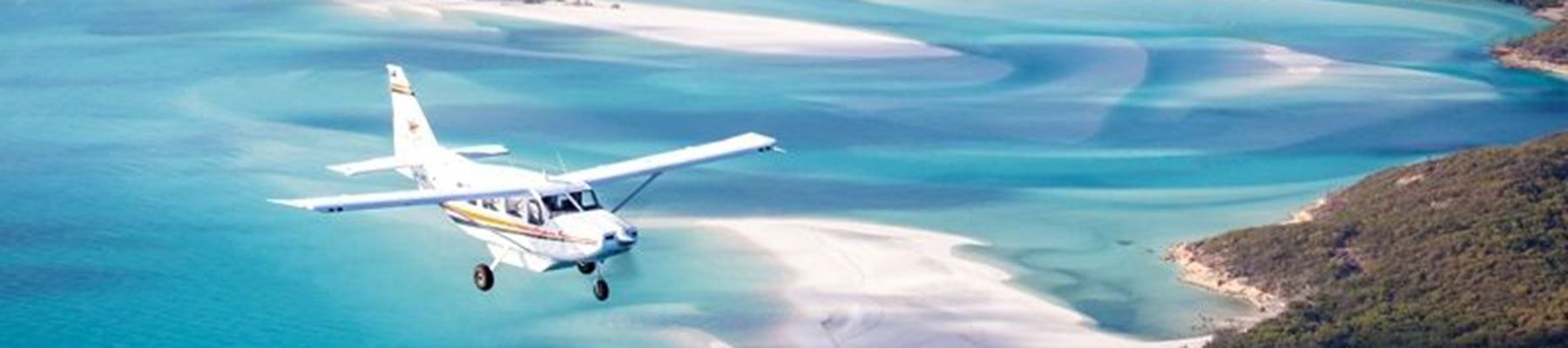 GSL scenic flight seaplane gliding over reefs and islands