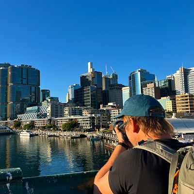 Sydney City Bays with a man photographing view