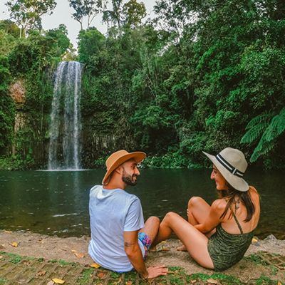 Couple sitting together at Millaa Millaa Falls