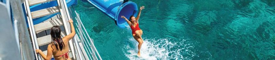 Person on waterslide, Sunlover Moore Reef pontoon