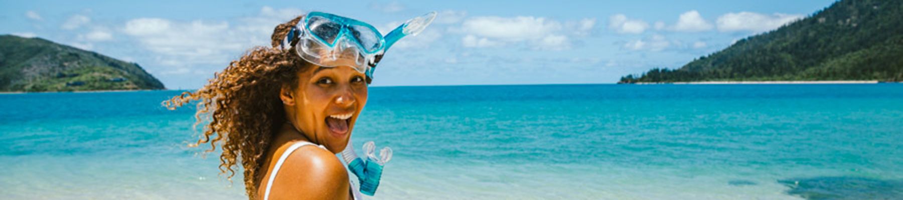 Girl with snorkel in the reef