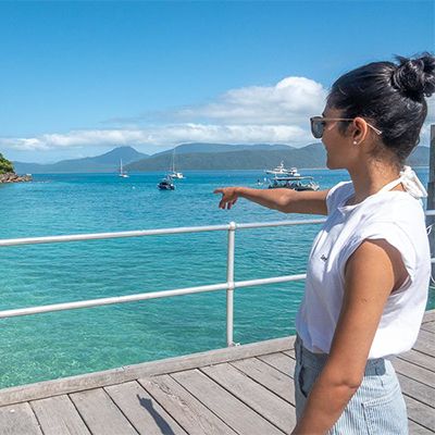 girl pointing at the views on fitzroy island cairns