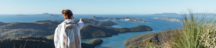 Person pointing out to the distance on a Whitsunday Islands hike