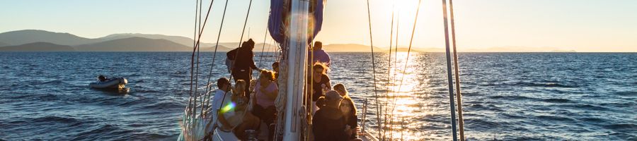 People aboard the Southern Cross sailing yacht in the Whitsundays