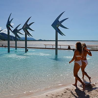 Lagoon in Cairns with women in bikinis 