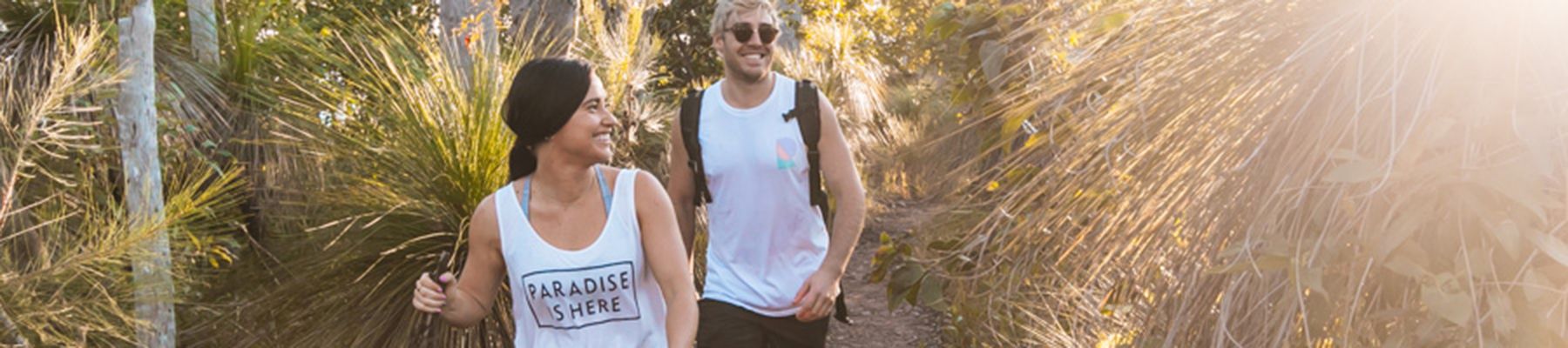 Couple walking through trees