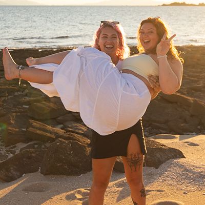 Two women at sunset having fun