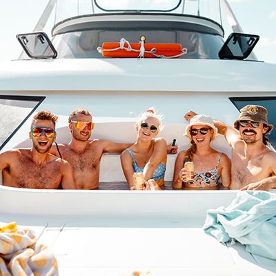 A group of backpackers in a hot tub on a catamaran