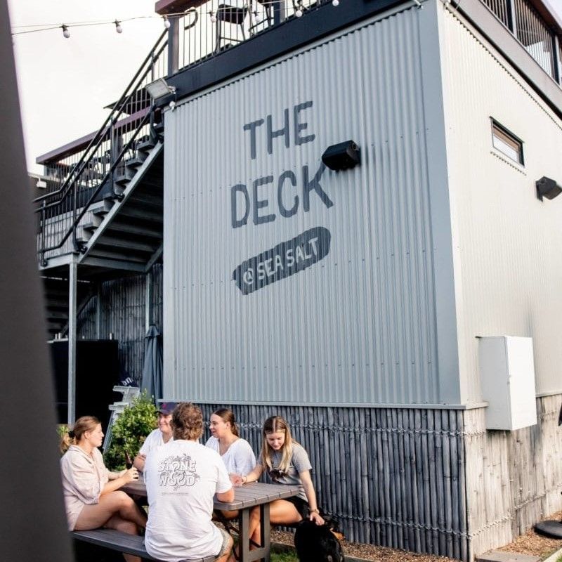 Young people enjoying drinks at The Deck