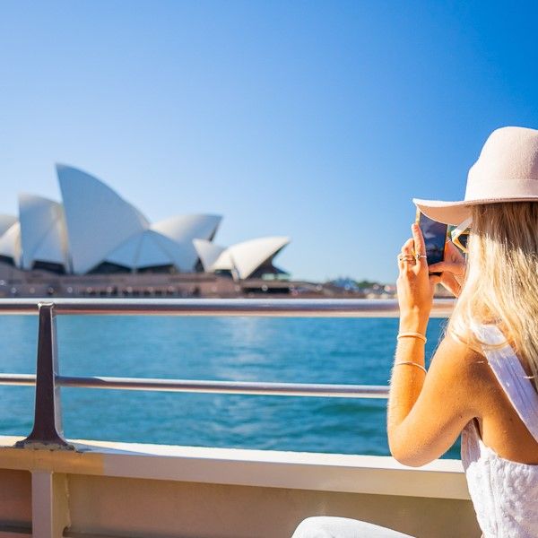 Girl taking pic of Sydney Opera House