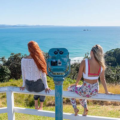 Two women taking in the view from the Byron Bay Lighthouse