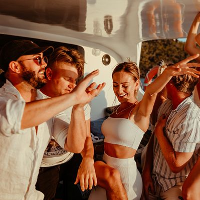 Group of people dancing on a boat