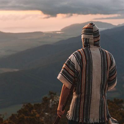 Man looking out at a mountain range